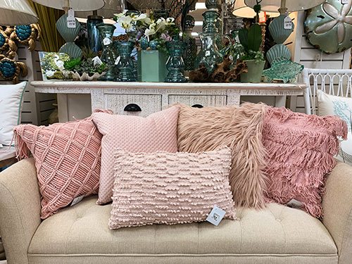 couch with pink pastel pillows